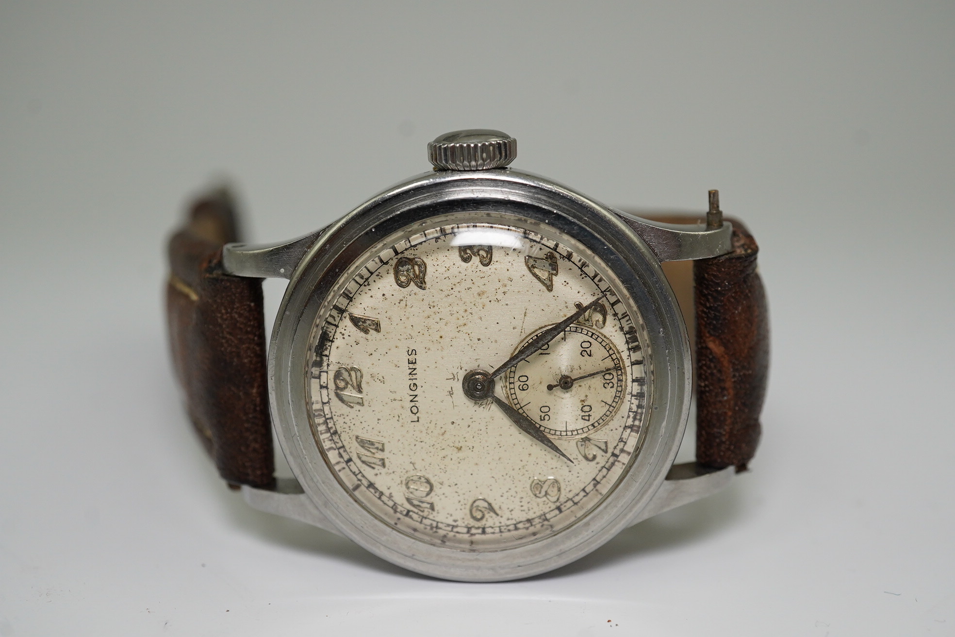 A gentleman's mid 1940's steel Longines military manual wind wrist watch